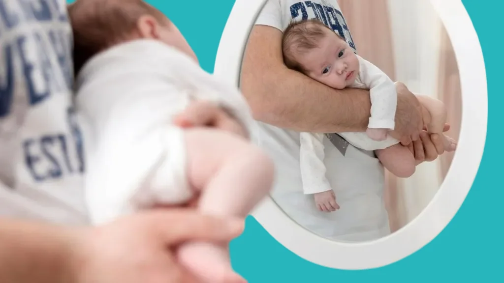 Carrying the baby on his stomach to treat colic in infants