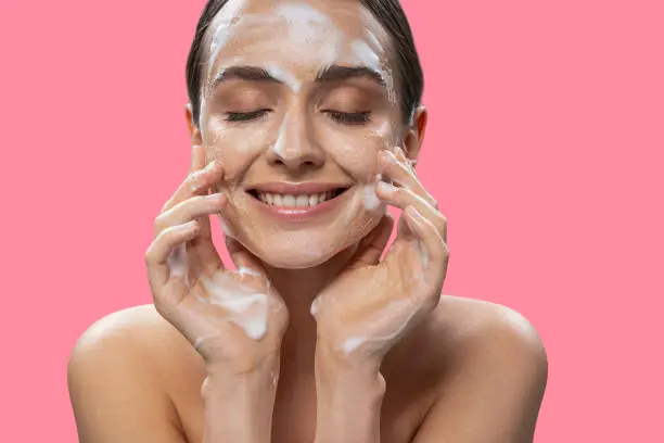 Face wasing before facial cleansing session