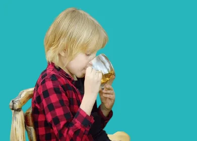 Drinking warm herbal teas to treat coughs in children